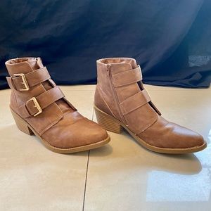 Woman's heeled camel colored booties with buckles